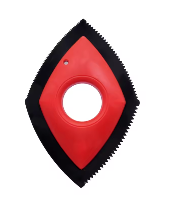 Red and black diamond-shaped tool with a central circular opening on a white background