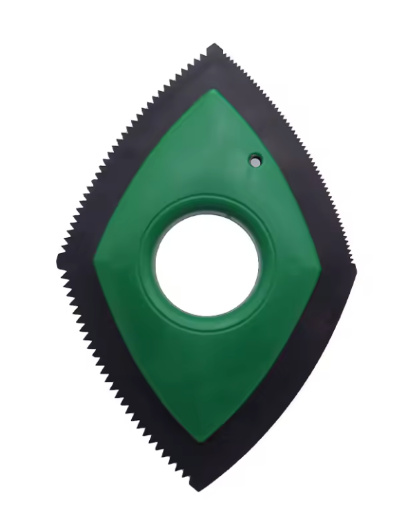 Green and black diamond-shaped tool with serrated edges on a white background