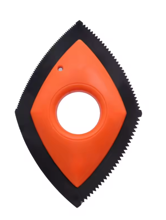 Orange and black diamond-shaped tool with a central circular hole on a white background
